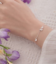 ブレスレット 腕輪 アクセサリー レディース 女性 婦人用 アズキチェーン かわいい キュート 細め シルバーカラー ラインストーン 蝶 バタフライ アジャスター フラワー ファッション小物