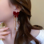 ピアス リボンタッセルピアス ロングピアス ラインストーン レディース 女性 婦人 アクセサリー 耳飾り 揺れる リボン プレゼント 贈り物