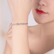 ブレスレット 腕輪 レディース 女性 ラインストーン アクセサリー お花モチーフ おしゃれ かわいい キラキラ 上品 パープル プレゼント ギフト