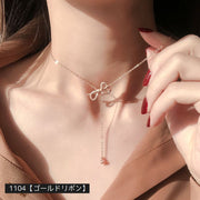 ネックレス ペンダント チャーム チェーンネックレス 首飾り レディース アクセサリー シンプル 上品 ラインストーン ゴールドカラー シルバーカラー リボン バー V字 フィッシュボーン