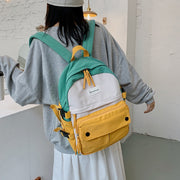 リュックサック デイパック レディース 女性用 バッグ かばん 大容量 バイカラー 配色 収納力 撥水 おしゃれ かわいい 通学 通勤 旅行 日常使い デイリー 学生 カジュアル 女の子 ピンク ブルー イエロー ブラック 青 黄色 黒