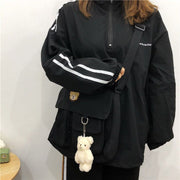 ショルダーバッグ レディース 女性 メンズ 男性 ユニセックス 男女兼用 鞄 カバン 長方形 横長 マグネットボタン フロントポケット バックル 帆布 キャンバス地 無地 ブラック ホワイト シンプル カジュアル 可愛い キュート おしゃれ 通勤 通学