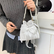 ショルダーバッグ 巾着バッグ レディース 女性 鞄 カバン リボン 巾着型 小型 コンパクト 小さめ シフォン生地 フェイクパール 無地 シンプル フェミニン ガーリー 可愛い かわいい キュート おしゃれ