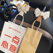 カーシートフック ヘッドレストフック 車載ホルダー 荷物掛け 車用ハンガー 車内収納 後部座席 レザー風リボン かわいい 可愛い