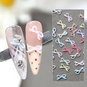 ネイルパーツ 同色50個セット ミニリボン 蝶結び 立体 ネイルアート 3Dアート ネイルチップ デコレーション セルフネイル
