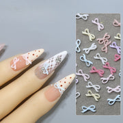 ネイルパーツ 同色50個セット ミニリボン 蝶結び 立体 ネイルアート 3Dアート ネイルチップ デコレーション セルフネイル