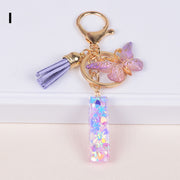 バッグチャーム キーホルダー キーリング キーチャーム レディース アルファベット 蝶 タッセル ラメ キラキラ 可愛い おしゃれ プチギフト プレゼント 贈り物 ファッション小物 女性用
