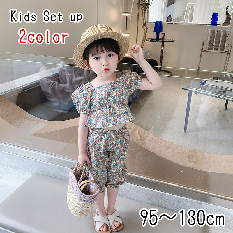 セットアップ 上下セット 2点セット ブラウス ハーフパンツ キッズ 女の子 トップス ボトムス 半袖 スクエアネック パフスリーブ ゴムウエスト 6分丈 裾ゴム ペプラム 総柄 花柄 ピンク レッド カラフル かわいい キュート 華やか リゾート着 夏