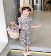 セットアップ 上下セット 2点セット ブラウス ハーフパンツ キッズ 女の子 トップス ボトムス 半袖 スクエアネック パフスリーブ ゴムウエスト 6分丈 裾ゴム ペプラム 総柄 花柄 ピンク レッド カラフル かわいい キュート 華やか リゾート着 夏
