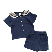 セットアップ 上下セット 半袖 シャツ ハーフパンツ 2点セット キッズ 子供服 男の子 女の子 男女兼用 ラウンドネック セーラーカラー風 ライン 前開き ボタン 半ズボン 短パン ウエストゴム ポケット付き マリン 単色 無地 シンプル 着回し かわいい おしゃれ カジュアル 定番 お出かけ 通園 通学 ユニセックス 青 ベージュ