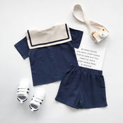 セットアップ 上下セット 半袖 シャツ ハーフパンツ 2点セット キッズ 子供服 男の子 女の子 男女兼用 ラウンドネック セーラーカラー風 ライン 前開き ボタン 半ズボン 短パン ウエストゴム ポケット付き マリン 単色 無地 シンプル 着回し かわいい おしゃれ カジュアル 定番 お出かけ 通園 通学 ユニセックス 青 ベージュ