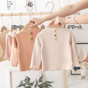カットソー 長袖 ロングTシャツ キッズ ベビー トップス 子供服 女の子 男の子 クルーネック メロウフリル 飾りボタン シンプル 無地 定番 カジュアル 遊び着 通園