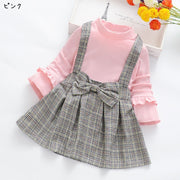 ドッキングワンピース キッズ 子供服 子ども服 女の子 フェイクツーピース フェイクレイヤード 重ね着風 ハイネック 長袖 Aライン ミニスカート ミニ丈 フレアスカート リボン 袖フリル ジャンパースカート風 総柄 チェック ブラック ピンク イエロー ガーリー 可愛い キュート カジュアル ライトフォーマル