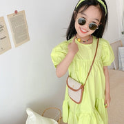 ワンピース キッズ 子供用 子ども用 女の子 半袖 丸首 ラウンドネック プルオーバー ティアードスカート フレアスカート 膝丈 パフスリーブ アシンメトリー アシメデザイン 無地 フェミニン ガーリー 可愛い かわいい キュート 春 夏 夏ワンピース リゾート 旅行 ビビッドカラー