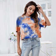 Tシャツ カットソー レディース 女性 トップス 半袖 丸首 ラウンドネック クルーネック ショート丈 丈短め 総柄 タイダイ柄 染物風 ブルー 華やか おしゃれ シンプル カジュアル 春 夏