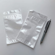 OPP袋 10×18cm 100枚入り ラッピング用品 チャック付き ヘッダー付き フック穴付き 透明 クリア 背面ホワイト 小物 梱包 収納 商品 業務
