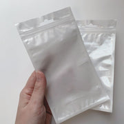 OPP袋 10×18cm 100枚入り ラッピング用品 チャック付き ヘッダー付き フック穴付き 透明 クリア 背面ホワイト 小物 梱包 収納 商品 業務