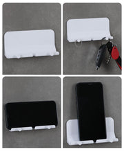 スマホホルダー スマートフォンスタンド スマホスタンド 壁掛け フック付き そのまま充電 イヤホンフック リモコンホルダー