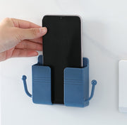 ウォールラック スマホ充電スタンド リモコンラック フック付き 小物入れ 壁掛け収納 ウォールケース スマホホルダー 壁面収納 整理整頓 ケーブル穴 小物入れ 眼鏡スタンド 粘着テープ式 穴あけ不要 収納用品 便利グッズ シンプル スタイリッシュ