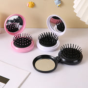 ヘアブラシ コーム コンパクトミラー レディース 女性 ファッション雑貨 生活雑貨 小さめ 手のひらサイズ コンパクトサイズ 折り畳み式 鏡付き 丸形 ラウンド 無地 ホワイト ピンク 可愛い キュート シンプル