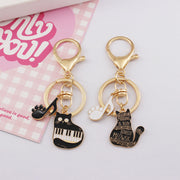 キーホルダー レディース 女の子 キーリング キーチェーン ピアノ 猫 黒猫 音符 ゴールドカラー 高級感 おしゃれ 定番 かわいい プレゼント 贈り物